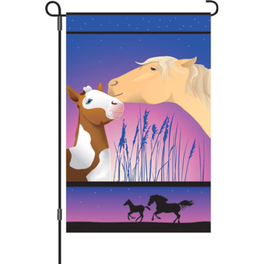 12 in. Whispering Horses garden flag displaying vibrant horses set against a warm autumn background in an outdoor setting.