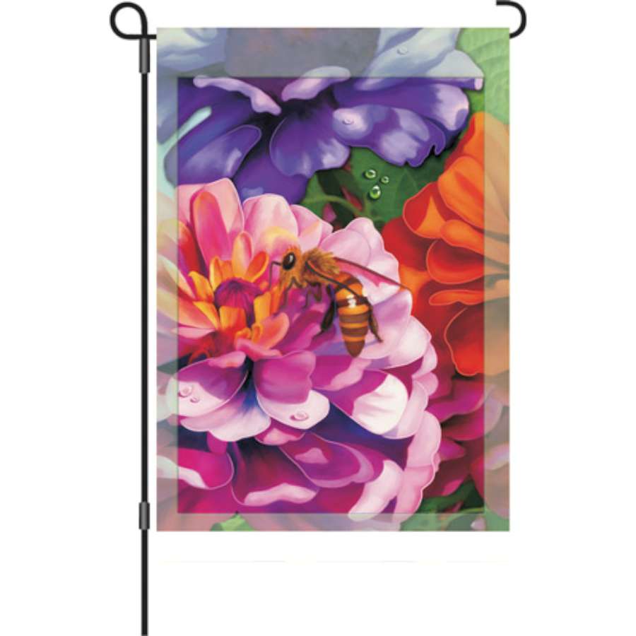12 in. Zinnias garden flag featuring colorful zinnia flower designs displayed on a flagpole in a bright outdoor garden setting.
