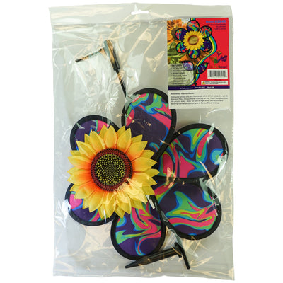 12\" Blue Psychedelic Sunflower garden spinner with colorful petals in motion, surrounded by greenery, enhancing outdoor aesthetics.