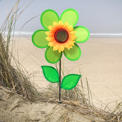 12-Inch Green Sunflower Spinner with vibrant green petals and detailed sunflower center, elegantly displayed in a garden setting.