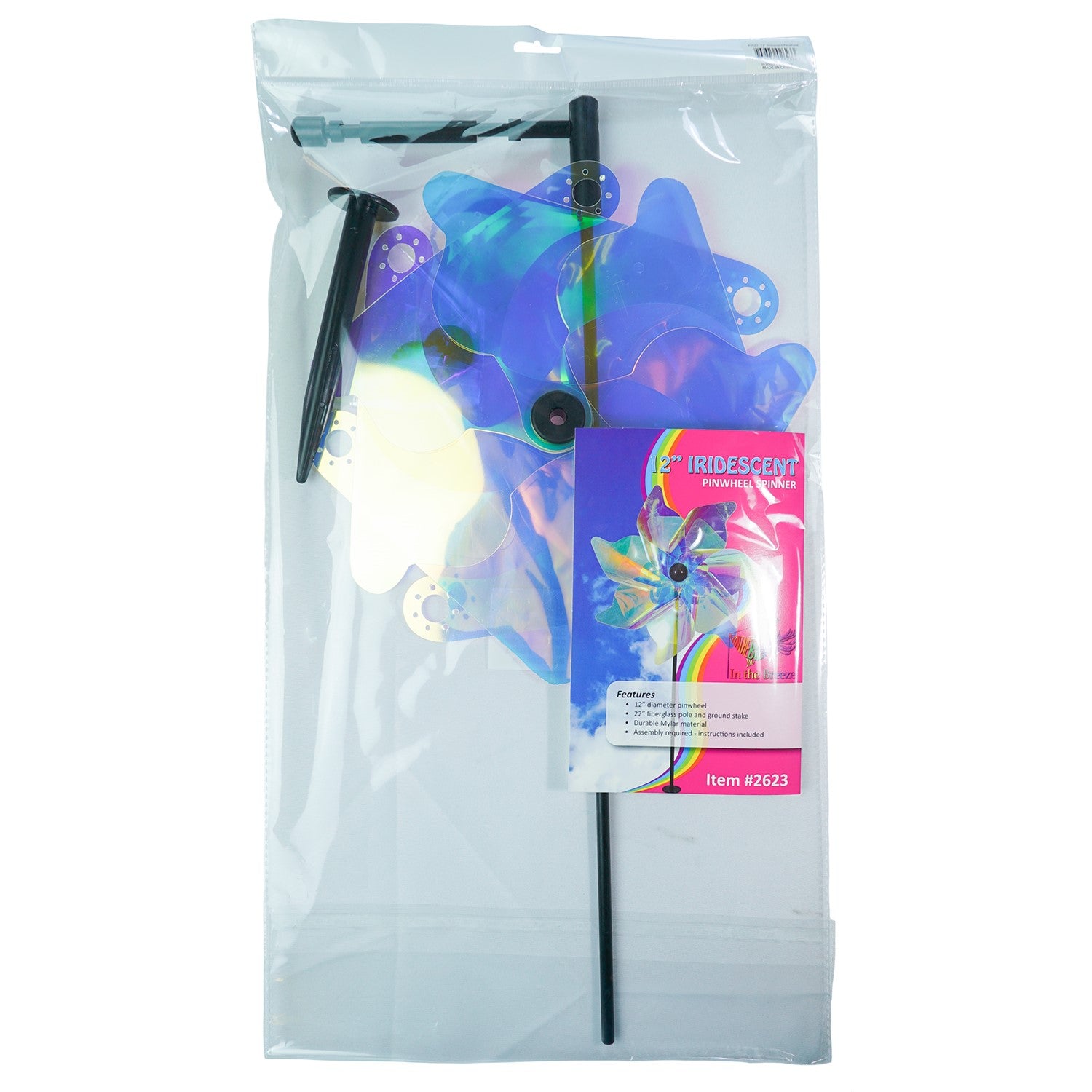 12-inch iridescent pinwheel spinner displayed in a garden, featuring colorful Mylar petals that catch the wind and reflect sunlight.