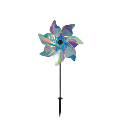 12-inch iridescent pinwheel spinner displayed in a garden, featuring colorful Mylar petals that catch the wind and reflect sunlight.