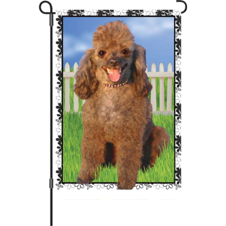 Jenna Poodle garden flag, illuminated design featuring a poodle and autumn leaves, displayed in a cozy garden setting.