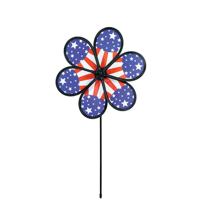 12-inch Patriot Star Flower Spinner with a vivid Stars and Stripes design, spinning on a garden pole in an outdoor setting.