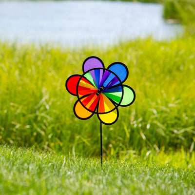 12-inch Rainbow Double Flower Wheel Combo wind spinner with vibrant colors, spinning gracefully in an outdoor garden setting.