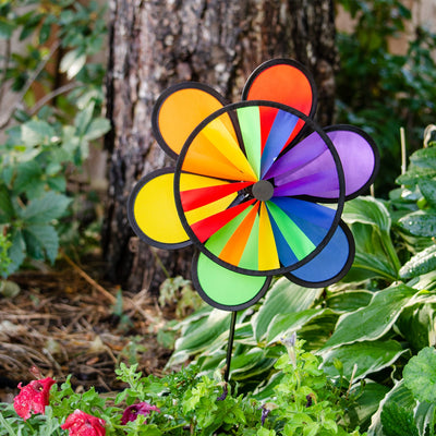 12-inch Rainbow Double Flower Wheel Combo wind spinner with vibrant colors, spinning gracefully in an outdoor garden setting.