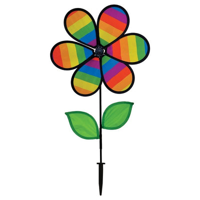 12-inch Rainbow Stripe Flower Spinner with vibrant petals and two leaves attached to a fiberglass pole, spinning in a garden setting.