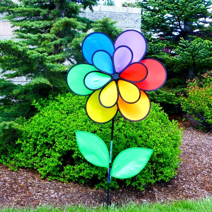 12-Petal Flower with Leaves Double Wheel Spinner featuring rainbow petals and leaves, displayed in a garden setting spinning gently in the breeze.