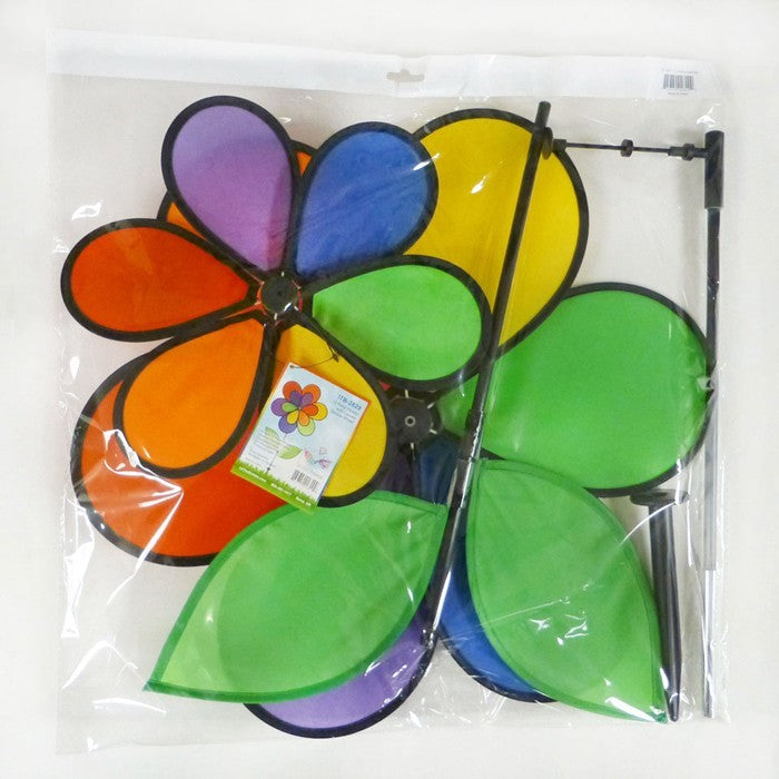 12-Petal Flower with Leaves Double Wheel Spinner featuring rainbow petals and leaves, displayed in a garden setting spinning gently in the breeze.