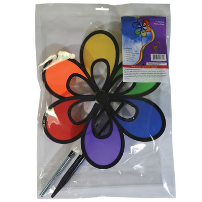 Colorful 12" Rainbow Windee Wheelz Spinner with petal design, set against a bright blue sky in a garden setting, showcasing its vibrant hues.