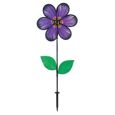 13.5-inch Aster Spinner with vibrant petals and green leaves, showcasing realistic flower design in an outdoor garden setting.
