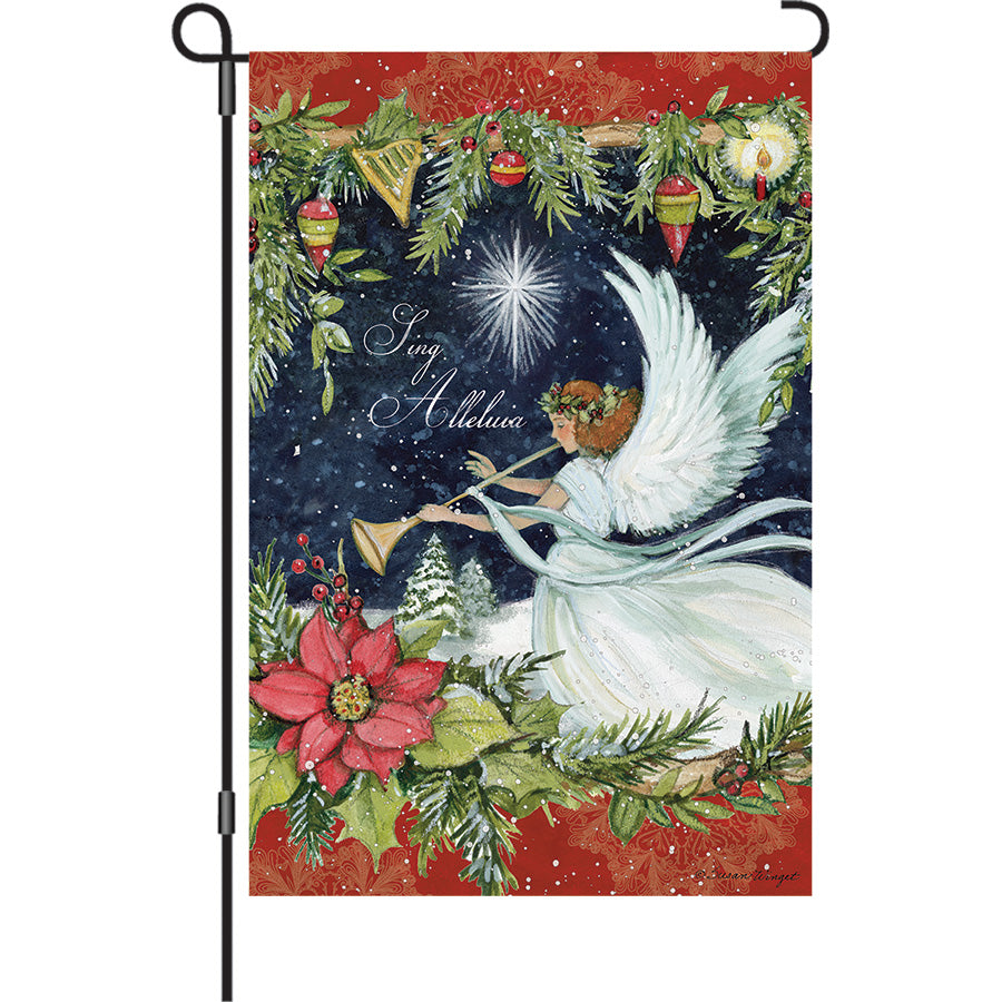 13 in. Elite Oversized Garden Flag with an Angel holding a horn, displayed outdoors on a garden flag pole, surrounded by holiday decorations.