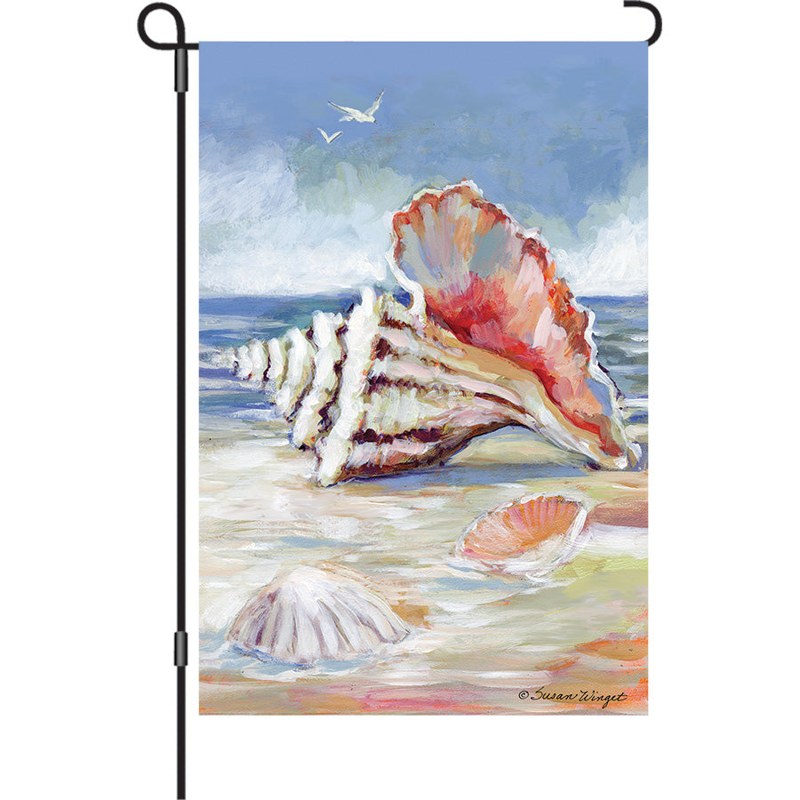 13 in. Elite Oversized Garden Flag featuring a vibrant conch shell design, displayed on a garden pole, enhancing the outdoor decor.