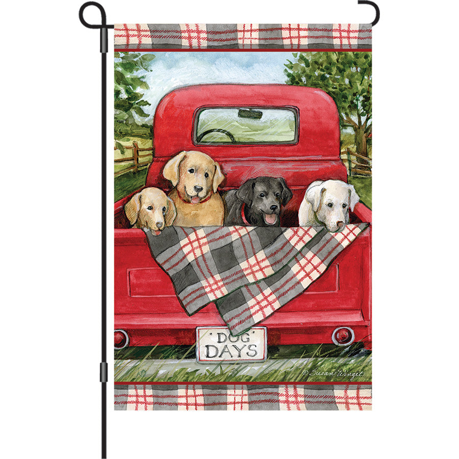 13 in. Elite Oversized Garden Flag featuring a vibrant dog-themed design, displayed on a garden flag pole in an outdoor setting.