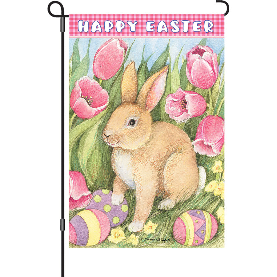 13 in. Elite Oversized Garden Flag featuring a cheerful Easter Bunny surrounded by tulips, waving gently in the breeze on a garden flag pole.