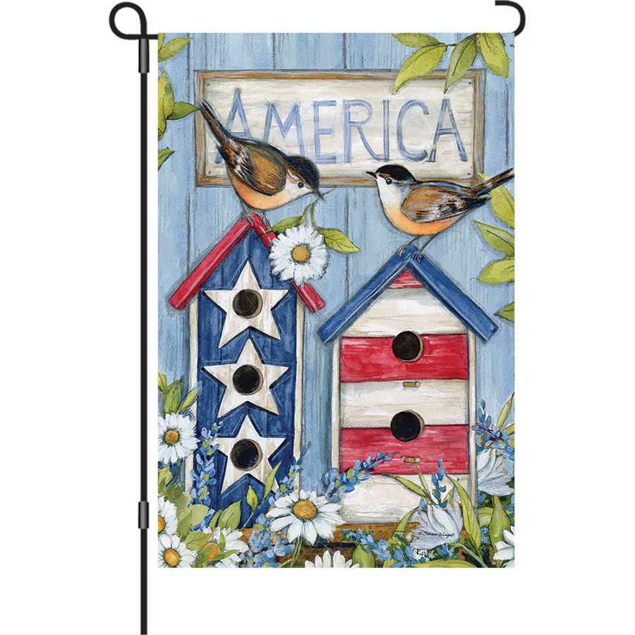 13 in. Elite Oversized Garden Flag showcasing colorful birdhouses in a patriotic theme, displayed on a standard garden flag pole in a vibrant outdoor setting.