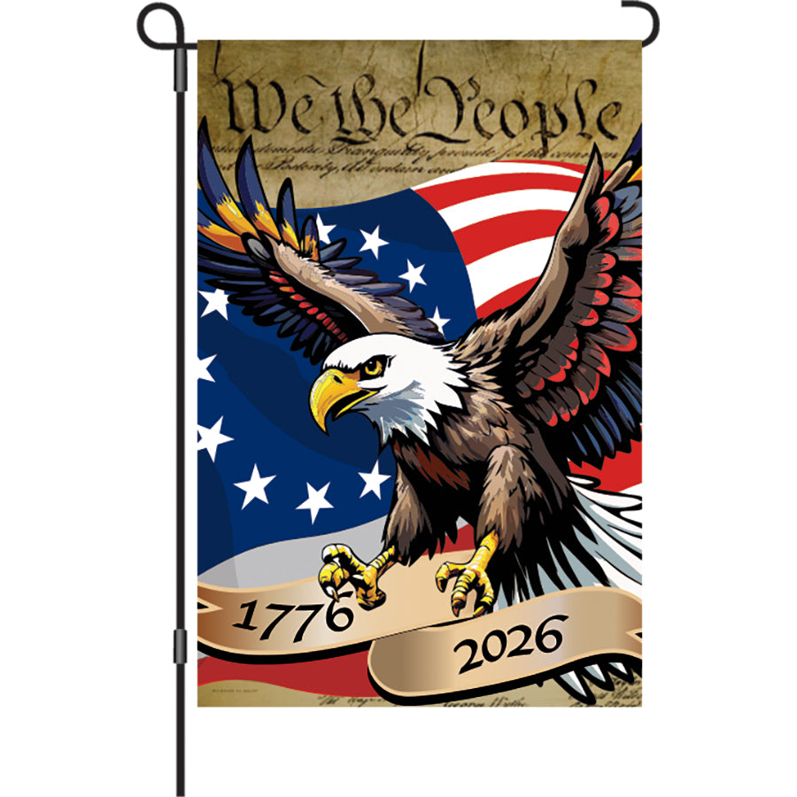13 in. Elite Oversized Garden Flag with 'We the People' patriotic eagle design displayed on a garden flag pole in a vibrant outdoor setting.