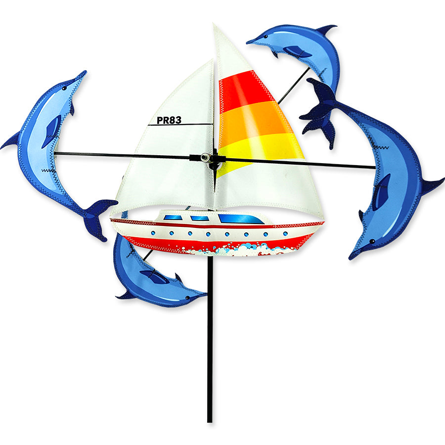 13 in. WhirliGig Spinner - Sailboat made of vibrant SunTex fabric, spinning in a gentle breeze against a garden backdrop.