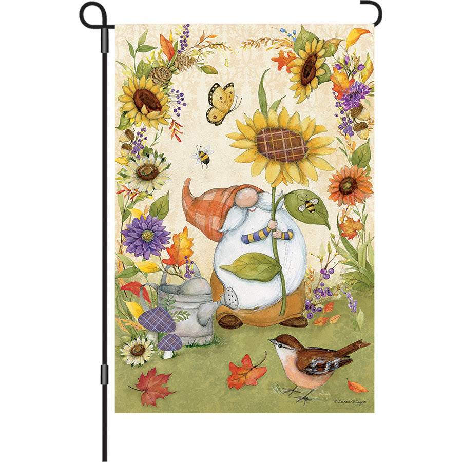 13 in. Elite Oversized Garden Flag with a colorful gnome and sunflowers, displayed on a standard garden flag pole in a vibrant outdoor setting.
