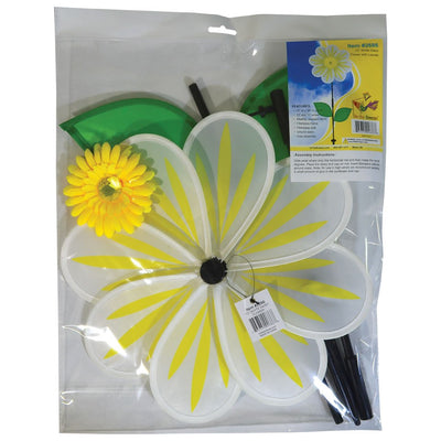 A 13-inch White Daisy Flower Spinner spinning in a garden, featuring an 8-petal design with a white floral motif against a natural backdrop.