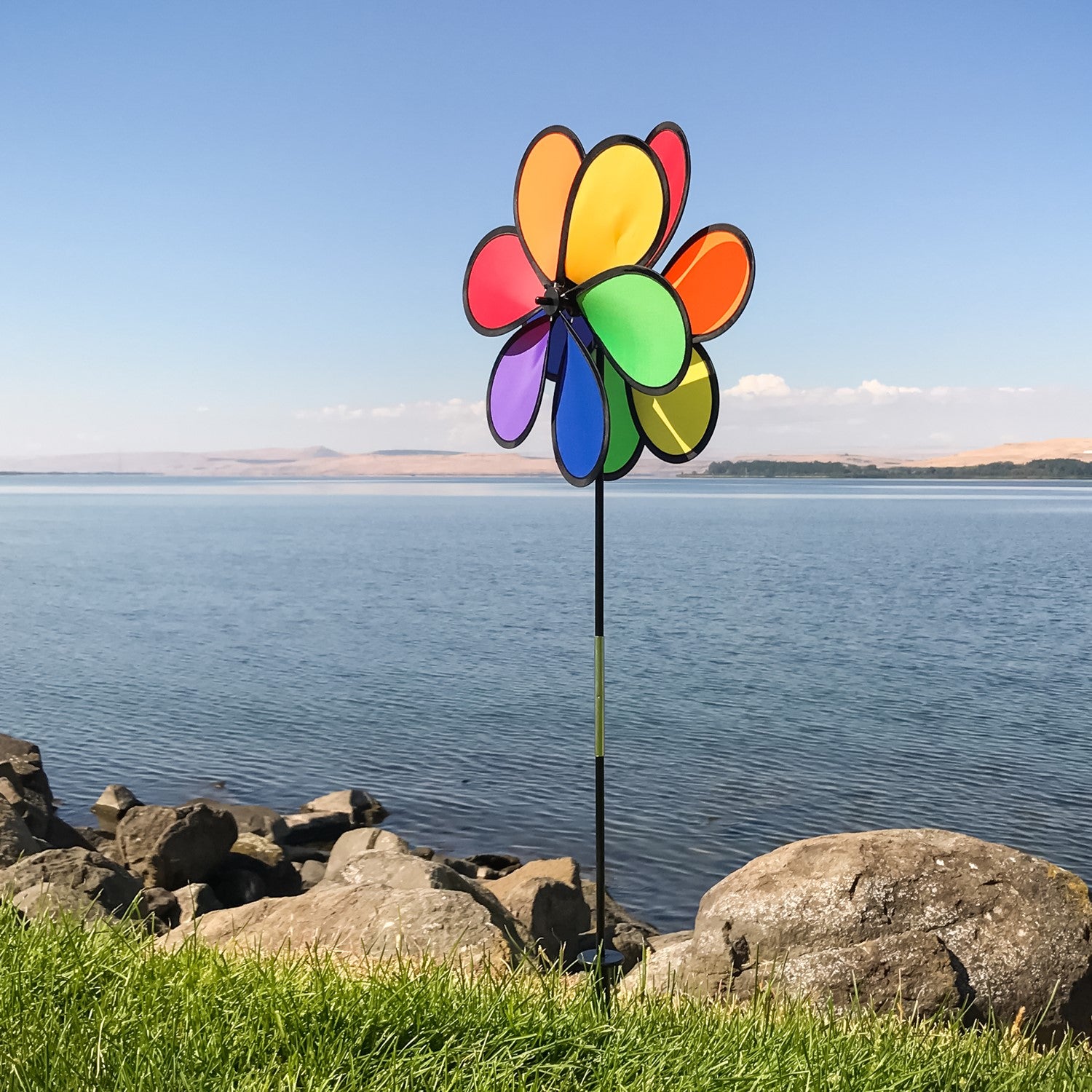 14" Double Flower Spinner features two rainbow-colored flower wheels spinning in opposite directions, adding dynamic decor to any garden.