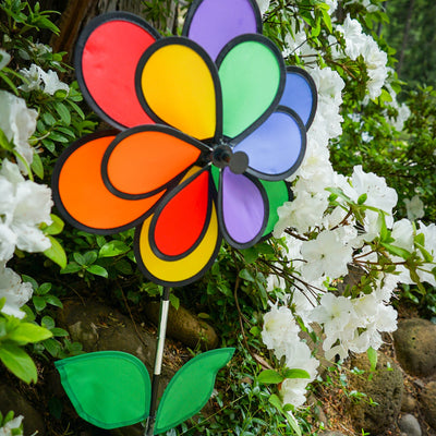 14-inch Rainbow Double Flower with Leaves garden spinner featuring colorful 12 petals and two green leaves, elegantly spinning in the breeze.
