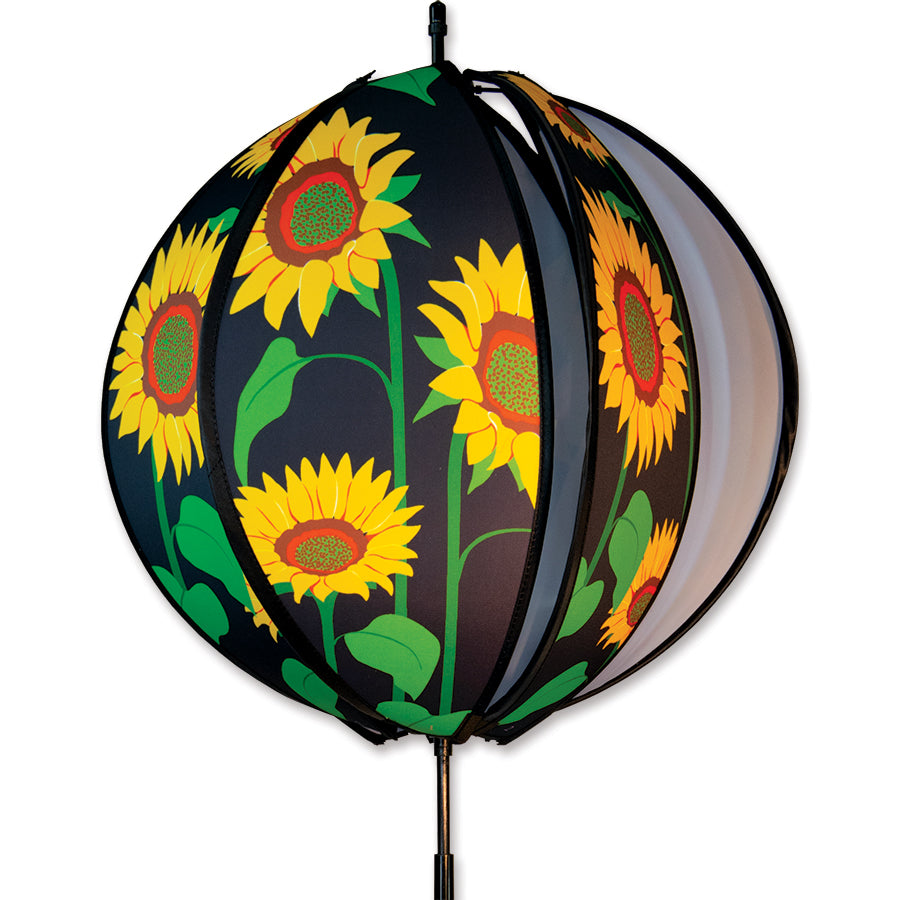 15 in. Ball Spinner - Sunflower with six colorful panels spinning gently in the wind, showcasing vibrant sunflower designs in a garden setting.