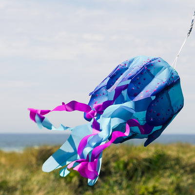 15-inch Blue Jellyfish 3D Windsock with vibrant colors and detailed design, showcasing fluttering tentacles in the outdoor breeze.