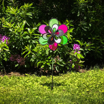15'' Domino Windee Wheelz and Flower Spinner displaying vibrant flower and wheel designs, swirling in the garden under gentle breezes.