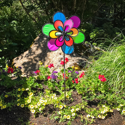 Brightly colored 15\" Neon Windee Wheelz and Flower Spinner in a garden setting, showcasing an animated flower design and spinning wheel.