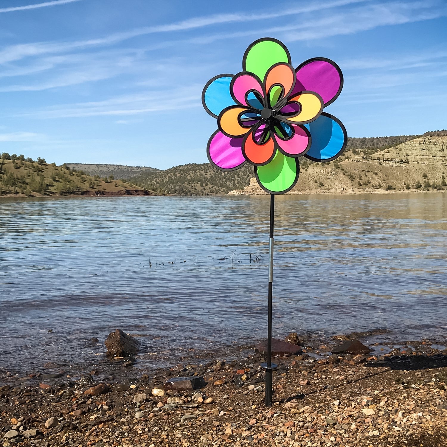Brightly colored 15\" Neon Windee Wheelz and Flower Spinner in a garden setting, showcasing an animated flower design and spinning wheel.