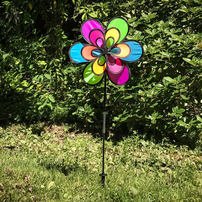 Brightly colored 15\" Neon Windee Wheelz and Flower Spinner in a garden setting, showcasing an animated flower design and spinning wheel.