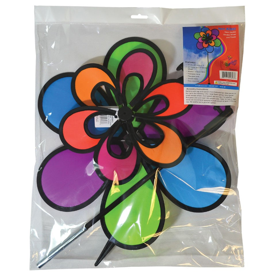 Brightly colored 15\" Neon Windee Wheelz and Flower Spinner in a garden setting, showcasing an animated flower design and spinning wheel.