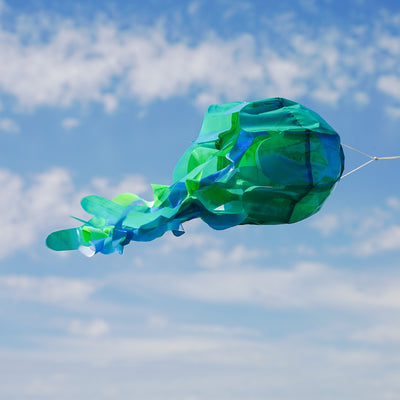 15-inch teal iridescent jellyfish 3D windsock with flowing tentacles and a shimmering finish, bringing ocean vibes to your yard while dancing in the wind.