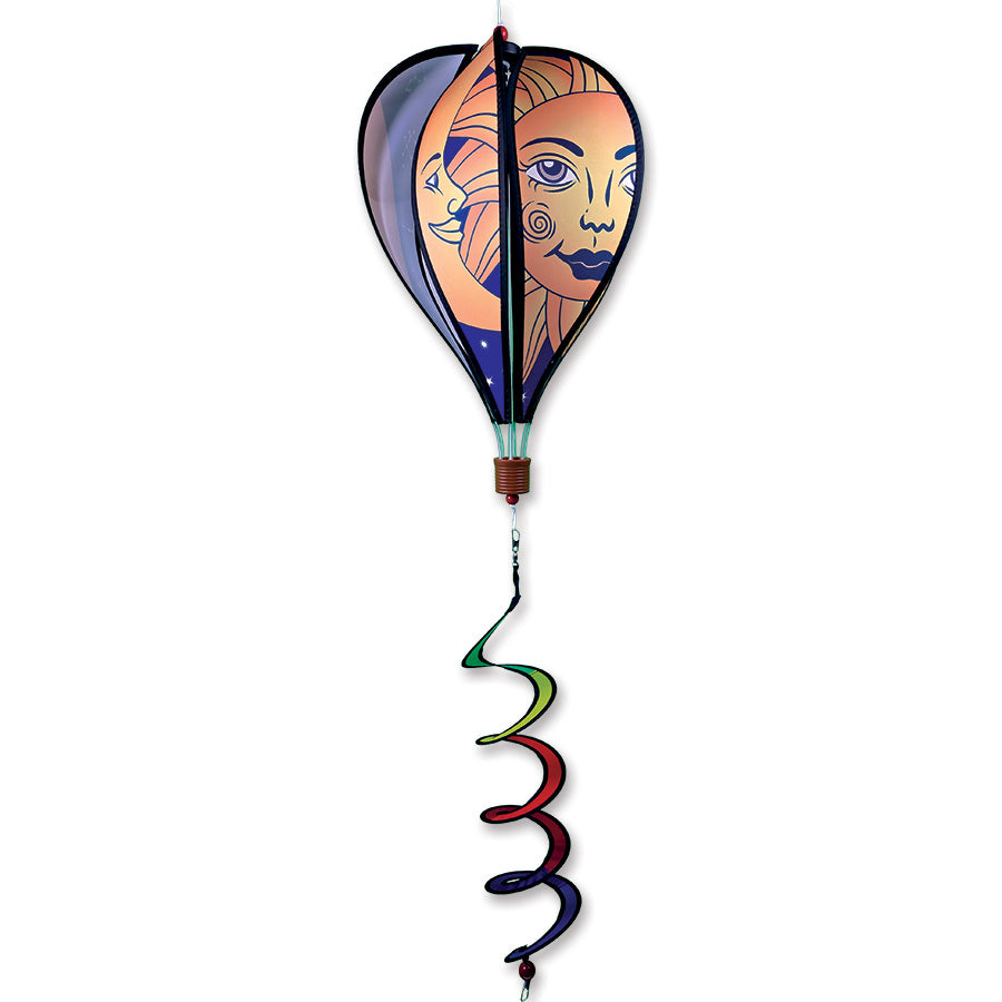 16 in. Hot Air Balloon with a Celestial Sun and Moon design, showcasing vibrant colors and a twister tail, spinning in an outdoor garden setting.