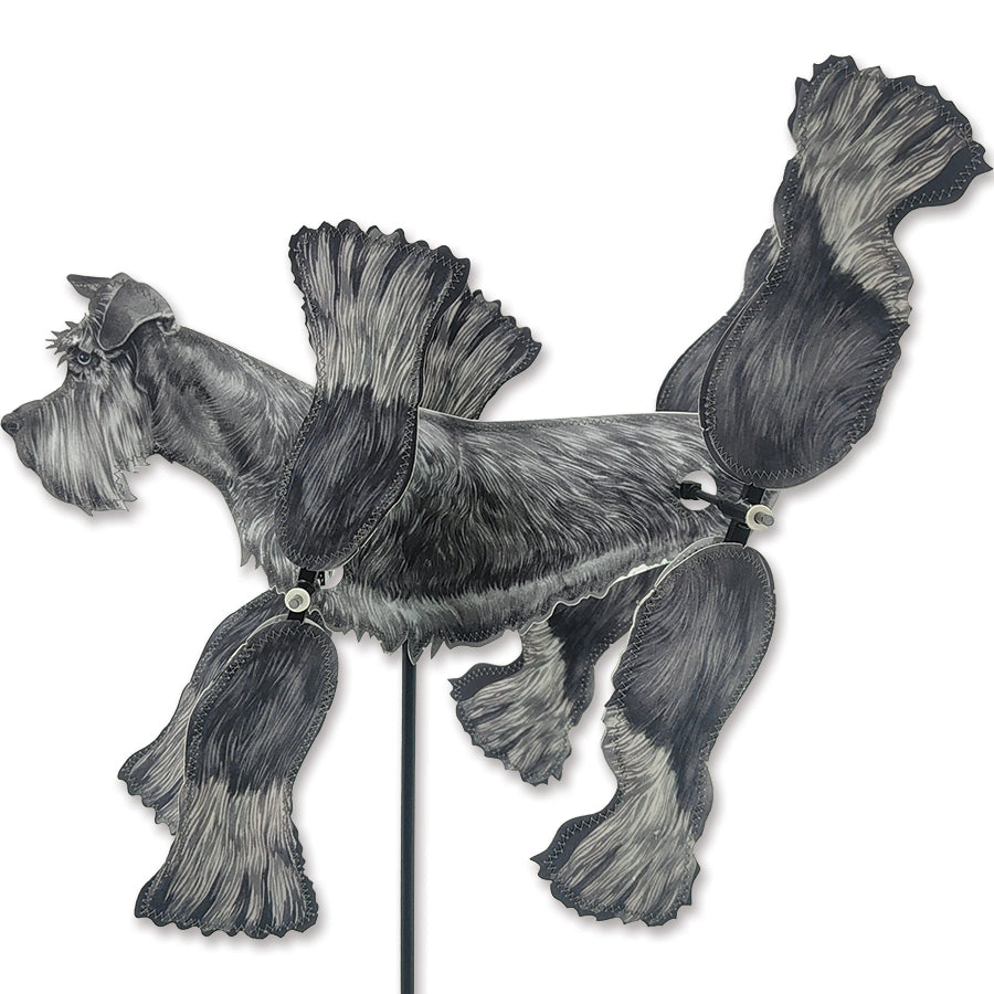 16 in. WhirliGig Spinner featuring a cheerful Schnauzer design, spinning gently in the breeze in a vibrant garden setting.