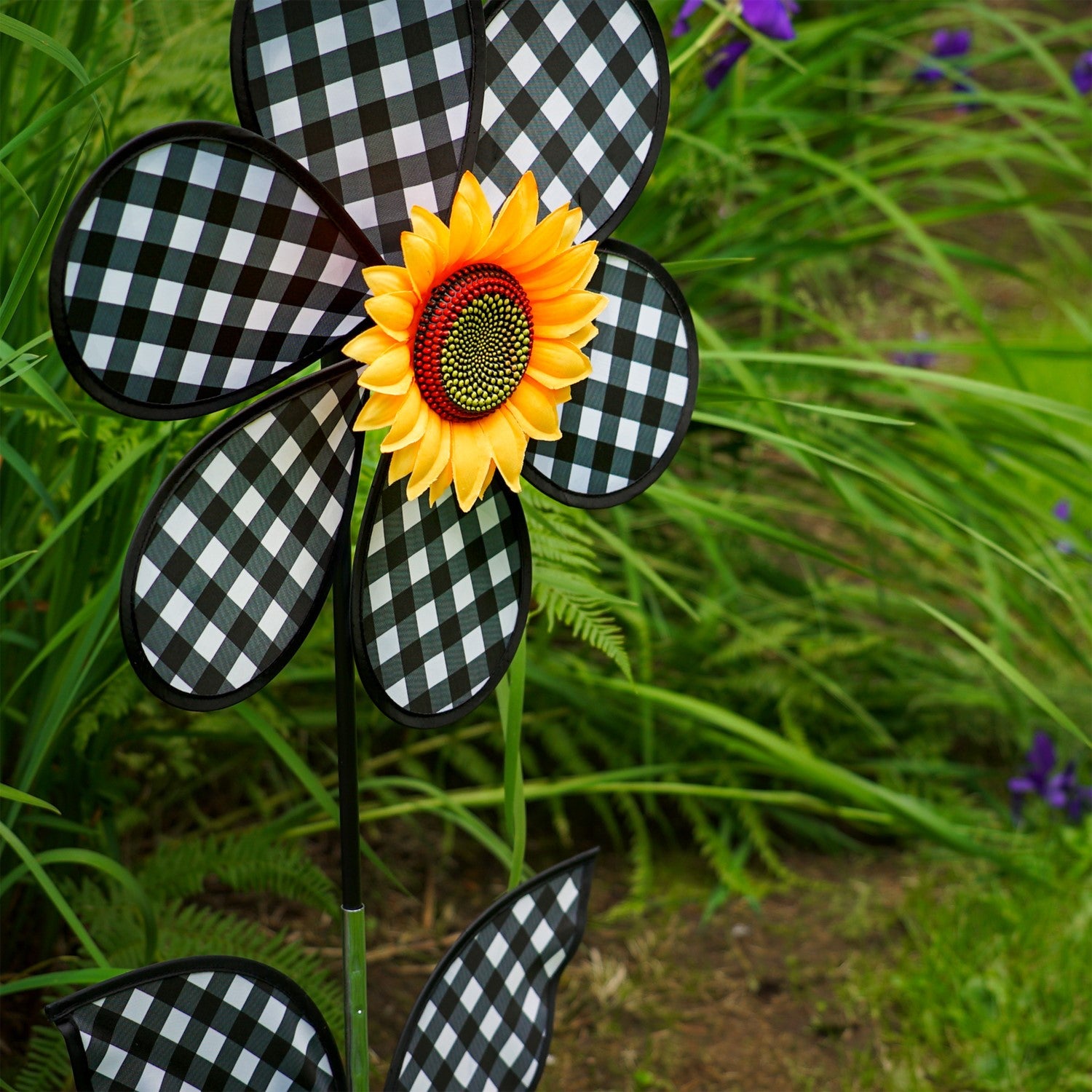 16-inch Gingham Flower with Leaves garden spinner with black gingham petals and leaves, rotating gently in the breeze on a pole.