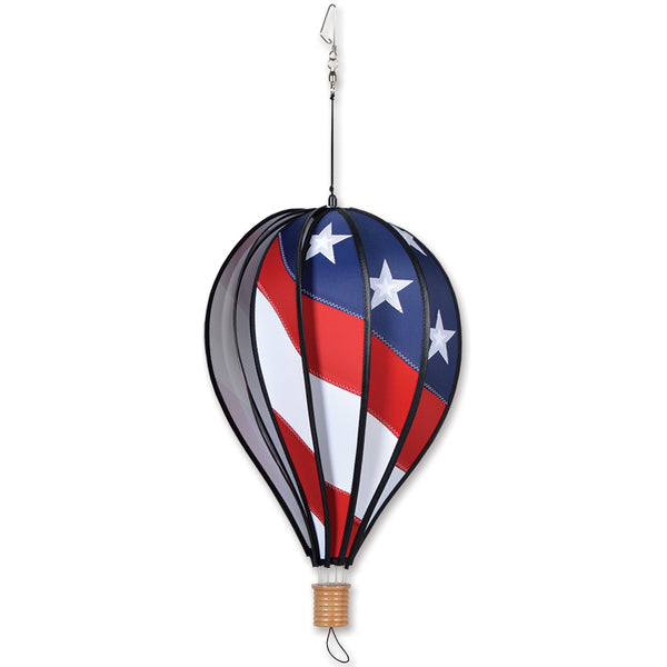 18 in. Hot Air Balloon with red, white, and blue colors spinning gracefully in the wind, showcasing its lively design for festive decor.