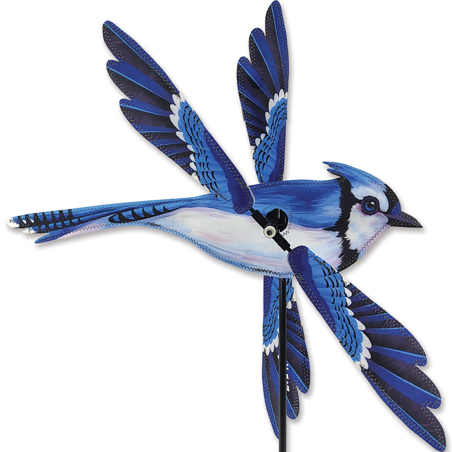 18 in. WhirliGig Spinner - Blue Jay with colorful fabric wings spinning in a gentle breeze in a vibrant garden setting.