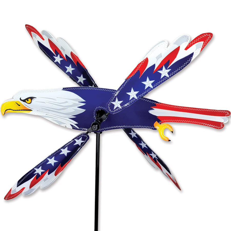 18 in. WhirliGig Spinner featuring a patriotic eagle design, spinning gracefully in light wind, set against a vibrant garden backdrop.