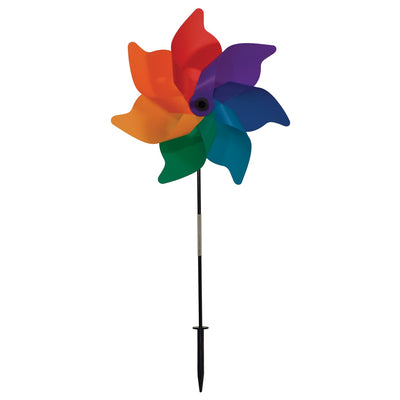 A vibrant 18\" Rainbow Poly Petal Spinner showing colorful petals spinning in the breeze, mounted on a two-section fiberglass pole in a garden setting.