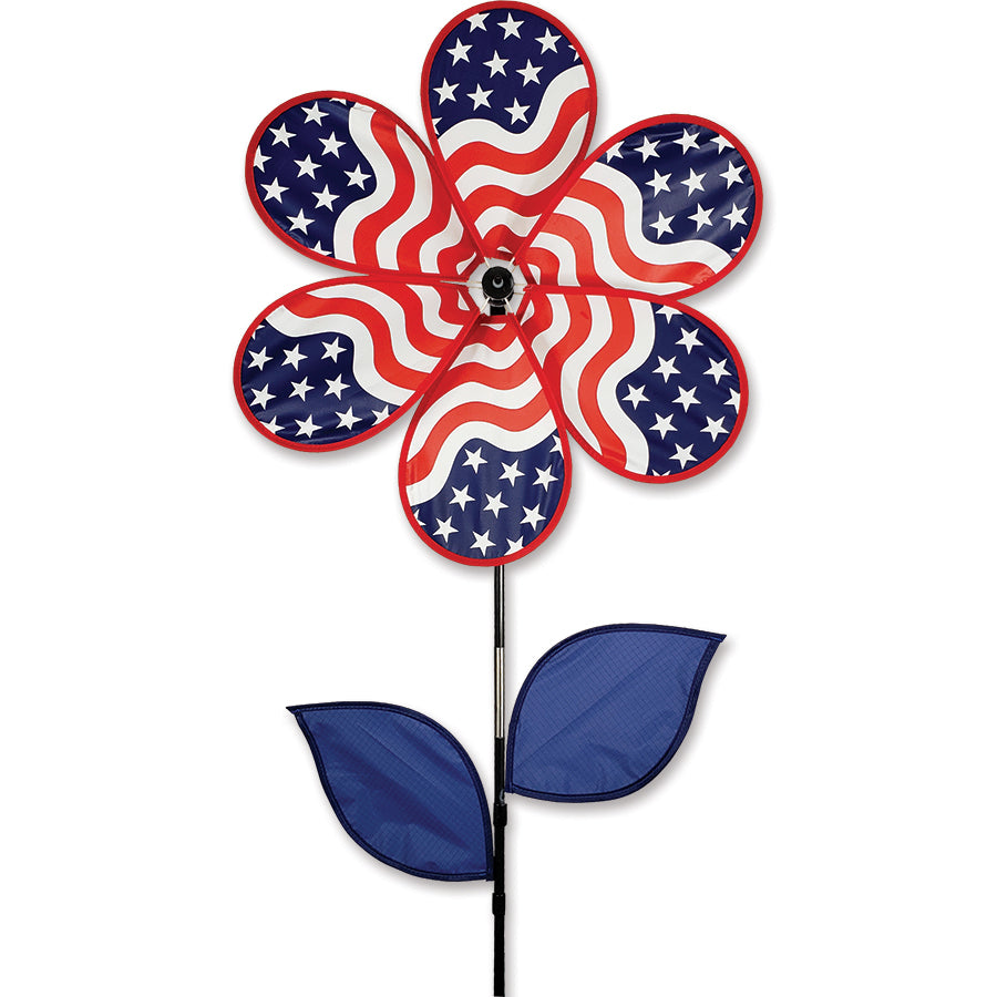 19 in. flower spinner with colorful petals in motion, showcased in a garden setting, designed to bring a cheerful touch to outdoor spaces.