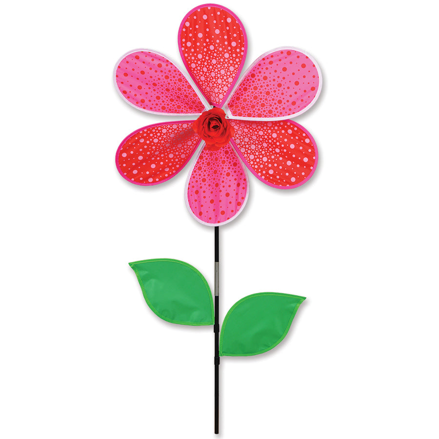 Colorful 19 in. Flower Spinner in the shape of a red rose, rotating in a garden setting, adding charm and motion to the outdoor area.