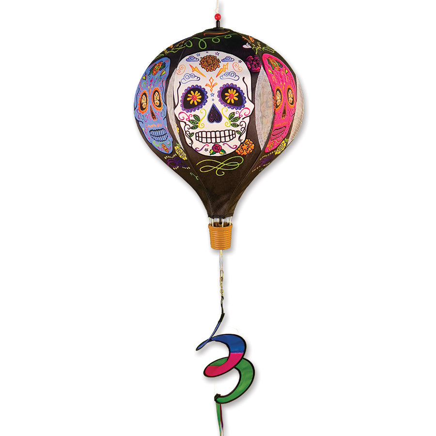 19 in. Pop-Open Hot Air Balloon - Day of the Dead Black, spinning in the wind, displayed on a porch, showcasing vibrant colors and festive design.