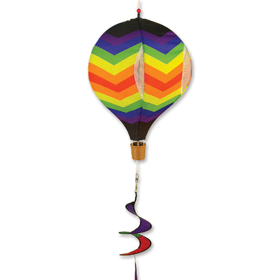 19 in. Pop-Open Hot Air Balloon showcasing a vibrant double chevron rainbow design, spinning in the outdoor breeze on a sunny day.