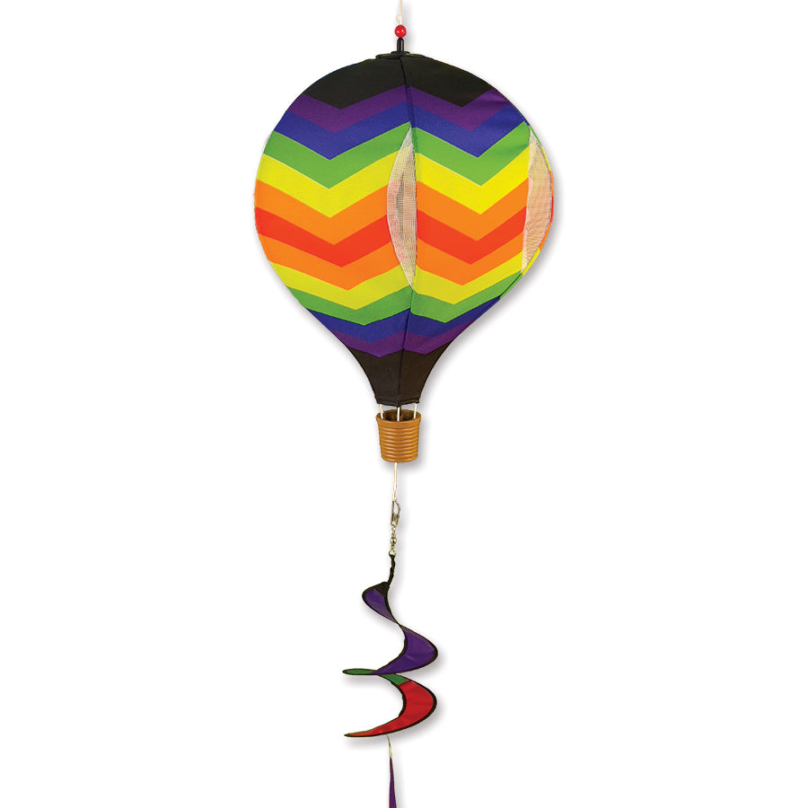 19 in. Pop-Open Hot Air Balloon showcasing a vibrant double chevron rainbow design, spinning in the outdoor breeze on a sunny day.