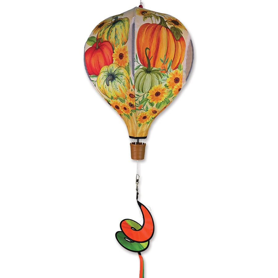 19 in. Pop-Open Hot Air Balloon with vibrant fall pumpkin design spins gracefully in the wind, adding seasonal charm to a porch or garden.