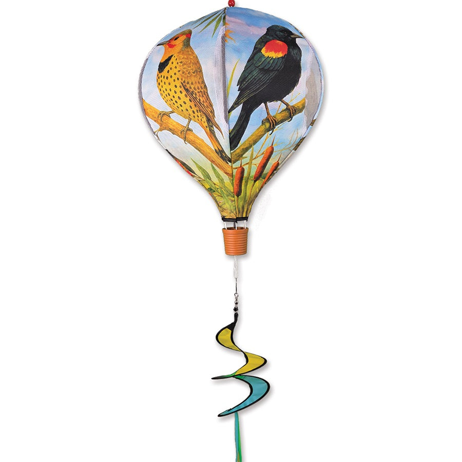 Colorful 19 in. Pop-Open Hot Air Balloon showcasing Great Plains birds, spinning gracefully on a deck in a serene outdoor setting.