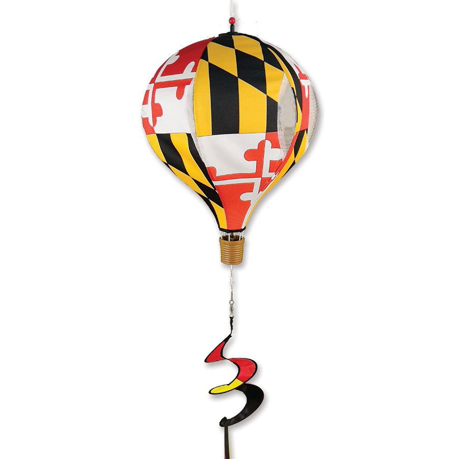 19 in. Pop-Open Hot Air Balloon with Maryland design, spinning in the wind on a deck with vibrant colors against a clear sky.