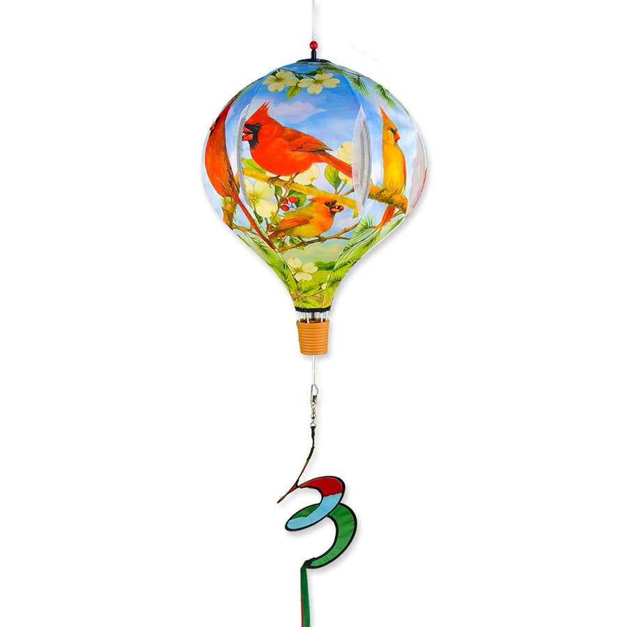 19 in. Pop-Open Hot Air Balloon featuring Northern Cardinal design, spinning gracefully in an outdoor setting with vibrant colors.
